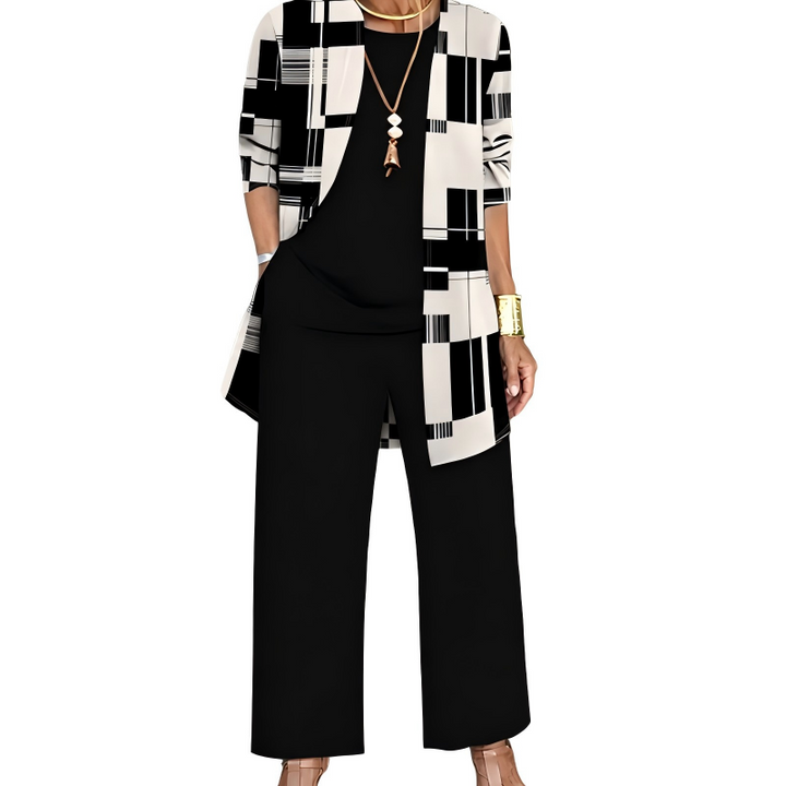 Black and cream version, the cardigan in a geometric block pattern over a black top and wide-leg black pants. 8