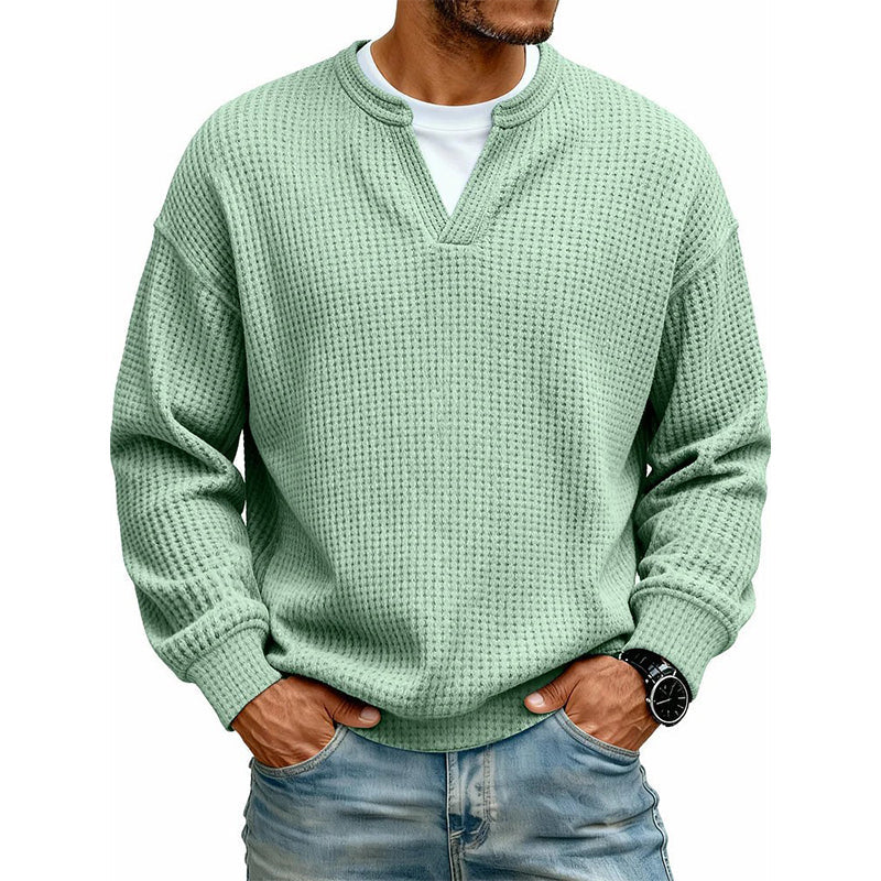 Front view of the top in mint green with a V-notch neckline, worn over a white tee 10