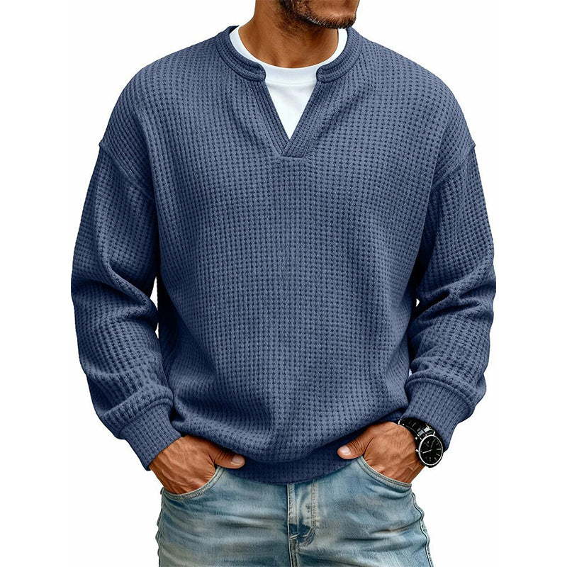 Front view of the top in deep navy blue waffle knit, worn over a white tee 13