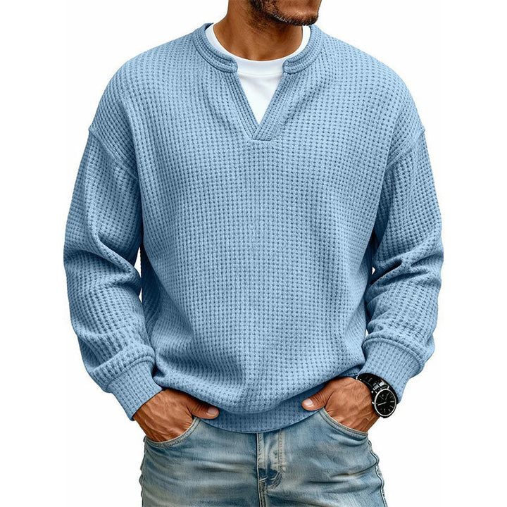Front view of the top in light blue waffle knit, hands in jeans pockets 12