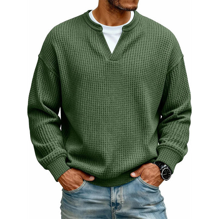Front view of the top in olive green waffle knit with a layered white tee underneath 18