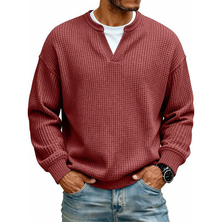 Front view of the top in brick red waffle knit, worn over a white tee 16