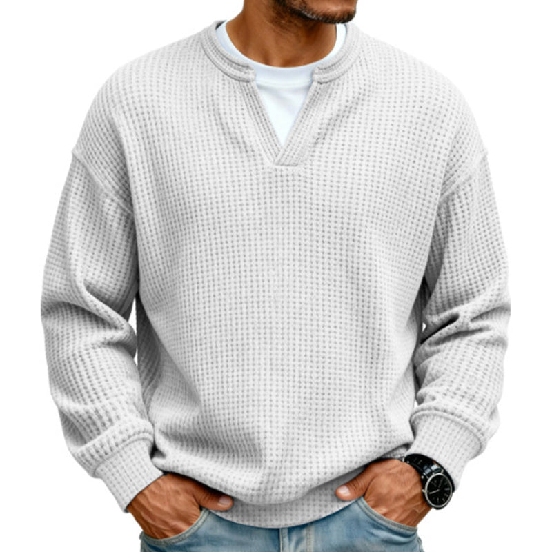Front view of the top in white waffle knit, worn over a white tee with jeans 14