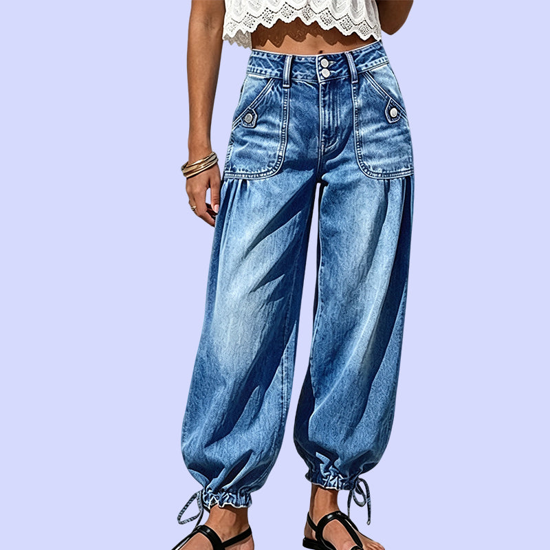 Women's blue barrel jeans with a two-button waistband, flap pockets and gathered drawstring hems.