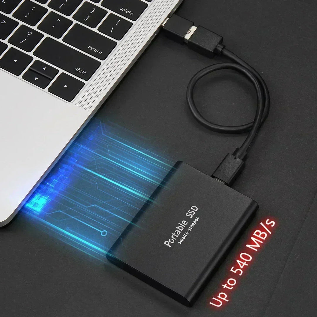 Black slim external drive plugged into a laptop by a cable, with glowing blue speed streaks 1