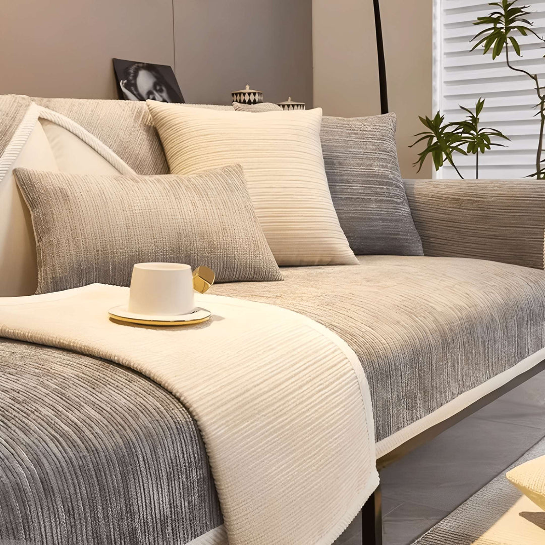 Grey anti-slip protective sofa cover detail with ribbed fabric and cream edge