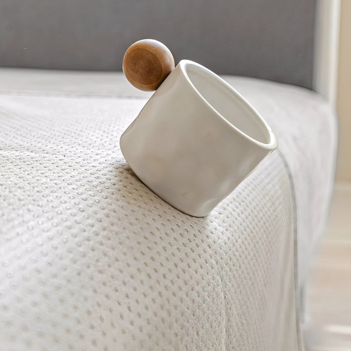 Grey anti-slip protective sofa cover detail showing the dotted non-slip backing