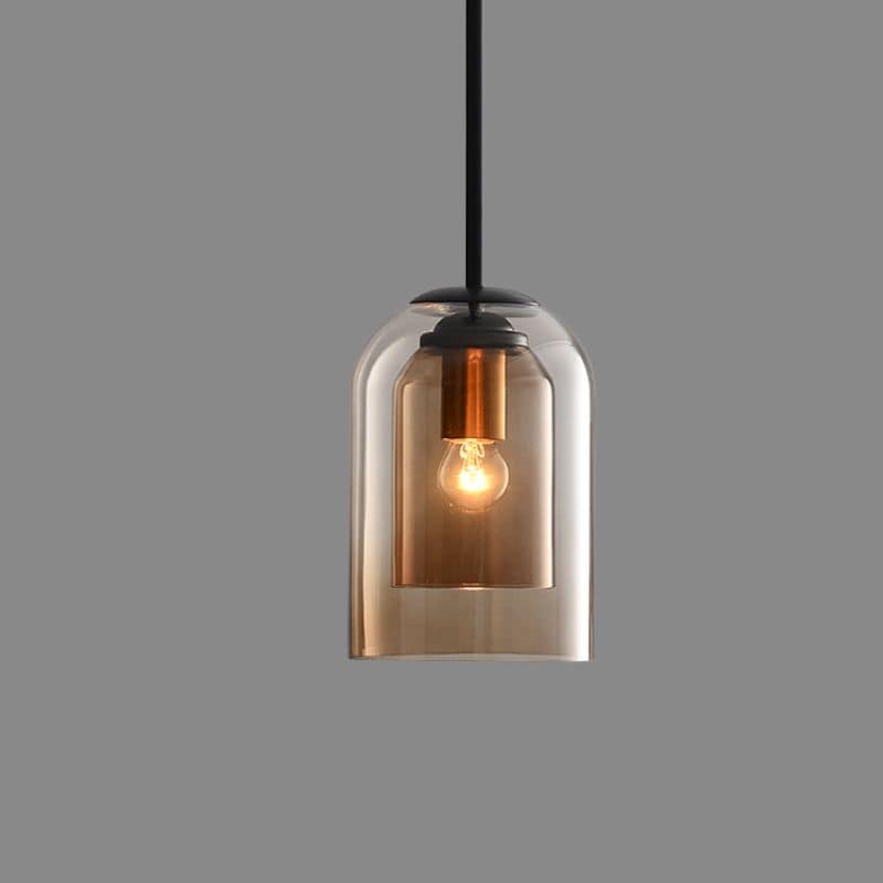 Amber pendant alone on a gray background, hanging from a black rod with its bulb lit 11