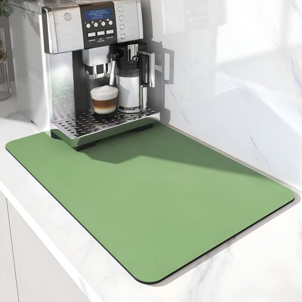 Sage green rectangular mat with rounded corners under a coffee machine on a white marble counter 6
