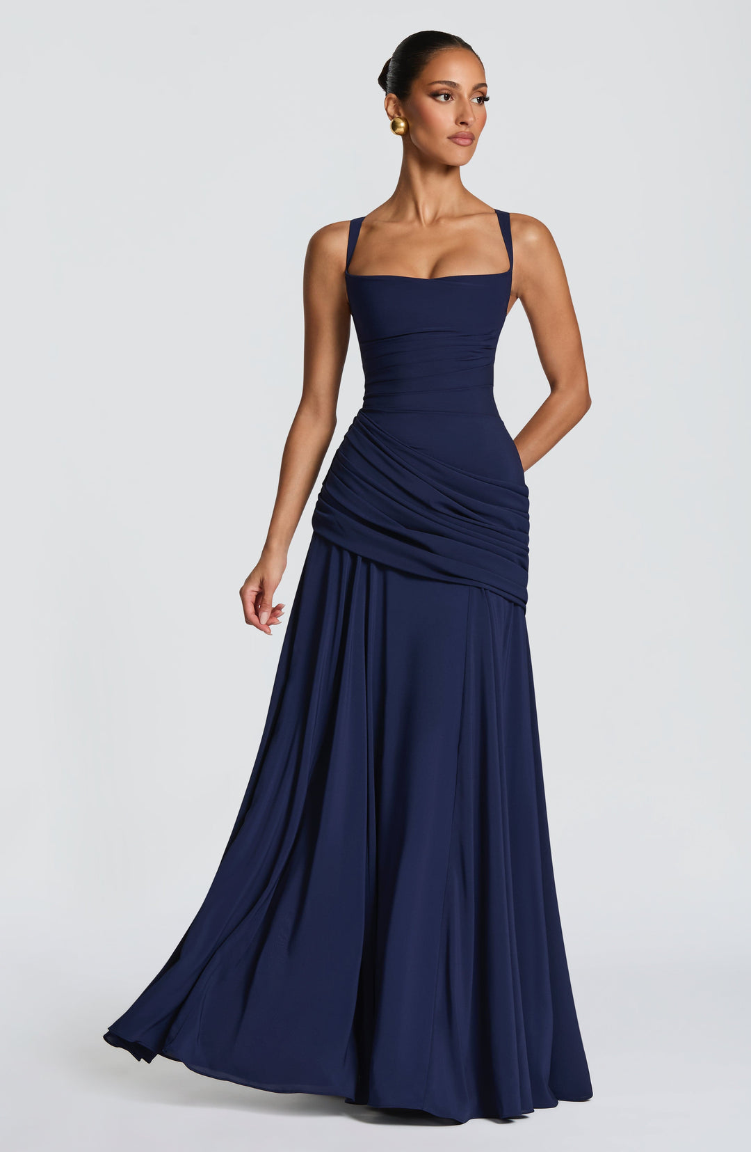 Navy dress in a slight turn, the chiffon skirt swinging out from the draped hip 6