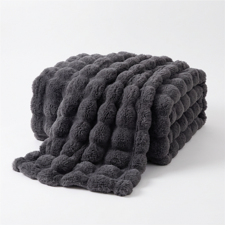 Dark gray plush throw folded and draped on a white background, showing its raised bubble texture 14