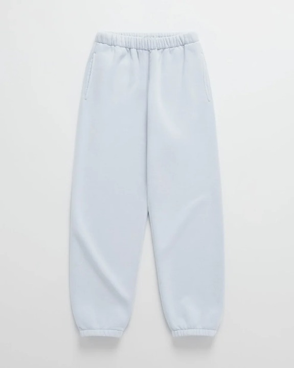Pale blue jogger sweatpants laid flat, with an elastic waistband, side pockets and elastic ankle cuffs 9
