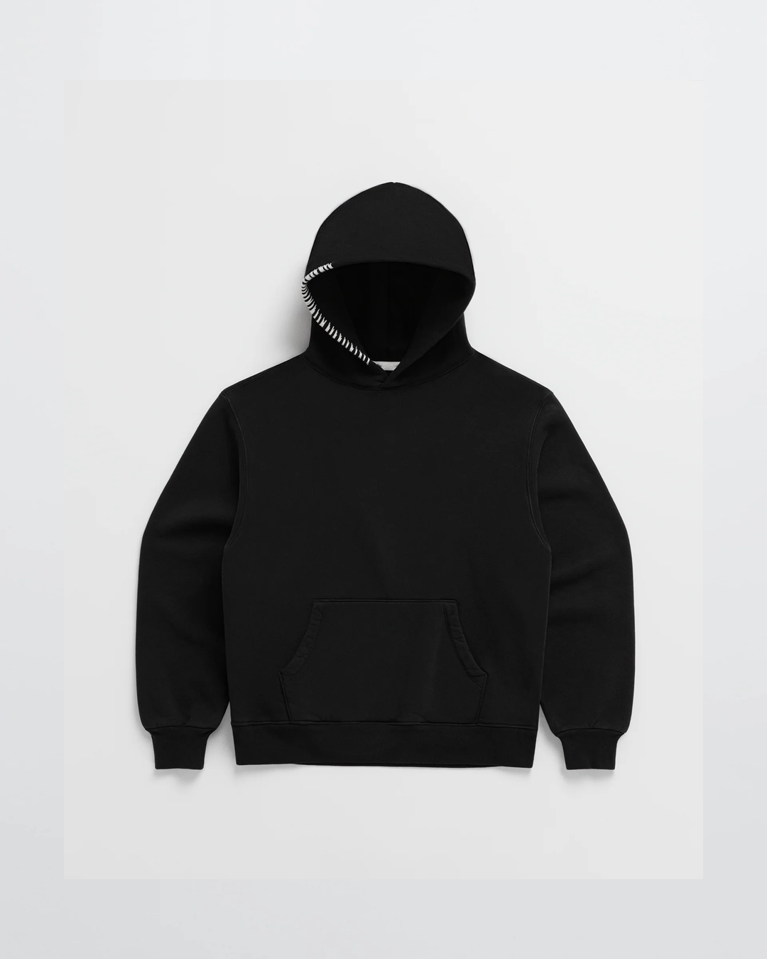Black hoodie laid flat, front view, with white stitching along the hood edge and a kangaroo pocket 5