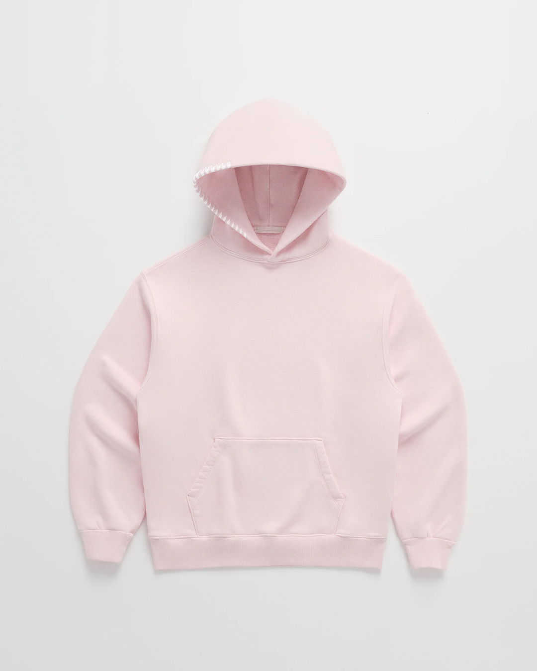 Light pink hoodie laid flat, front view, with white stitching along the hood edge and a front pouch pocket 3