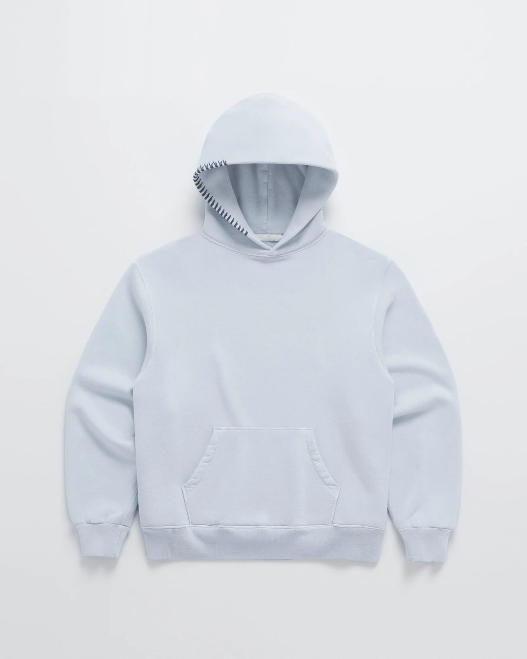 Pale blue hoodie laid flat, front view, with dark navy stitching along the hood edge and a kangaroo pocket 4