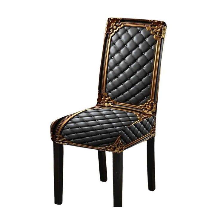 Dining chair in a black diamond-quilted print cover with gold baroque frame detail.