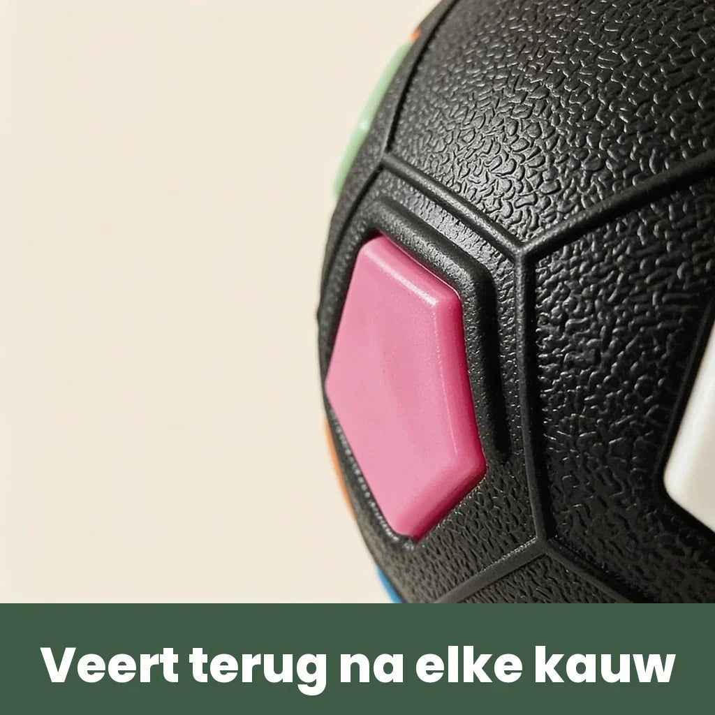 Close-up of the ball's pink panel and the grainy black rubber surface.