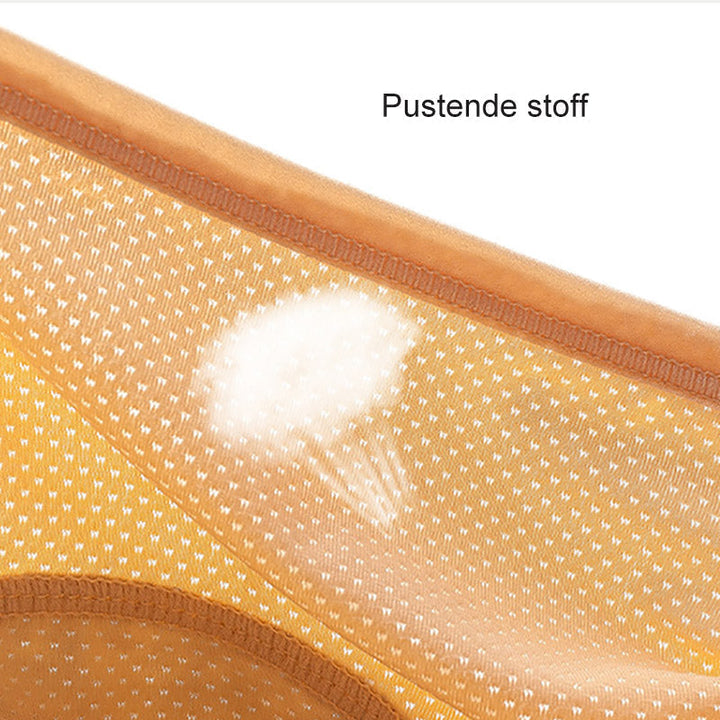Close-up of the perforated breathable mesh fabric on an orange pair, with a light airflow graphic over the dots. 10