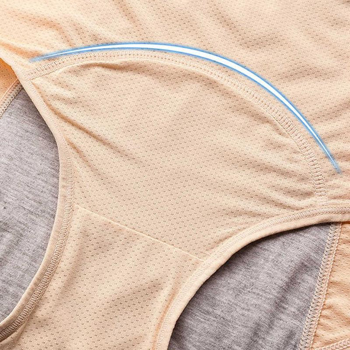 Close-up of the curved stitched gusset on beige mesh briefs with gray inner lining and a blue curved highlight line. 11