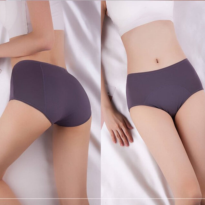 Back and front views of a model lying on white sheets in dusty purple high-waisted briefs and a white top. 5