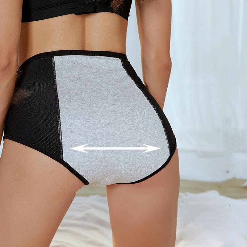 Back view of black briefs with a gray stretch center panel and black mesh sides, with an arrow showing the panel stretching. 7