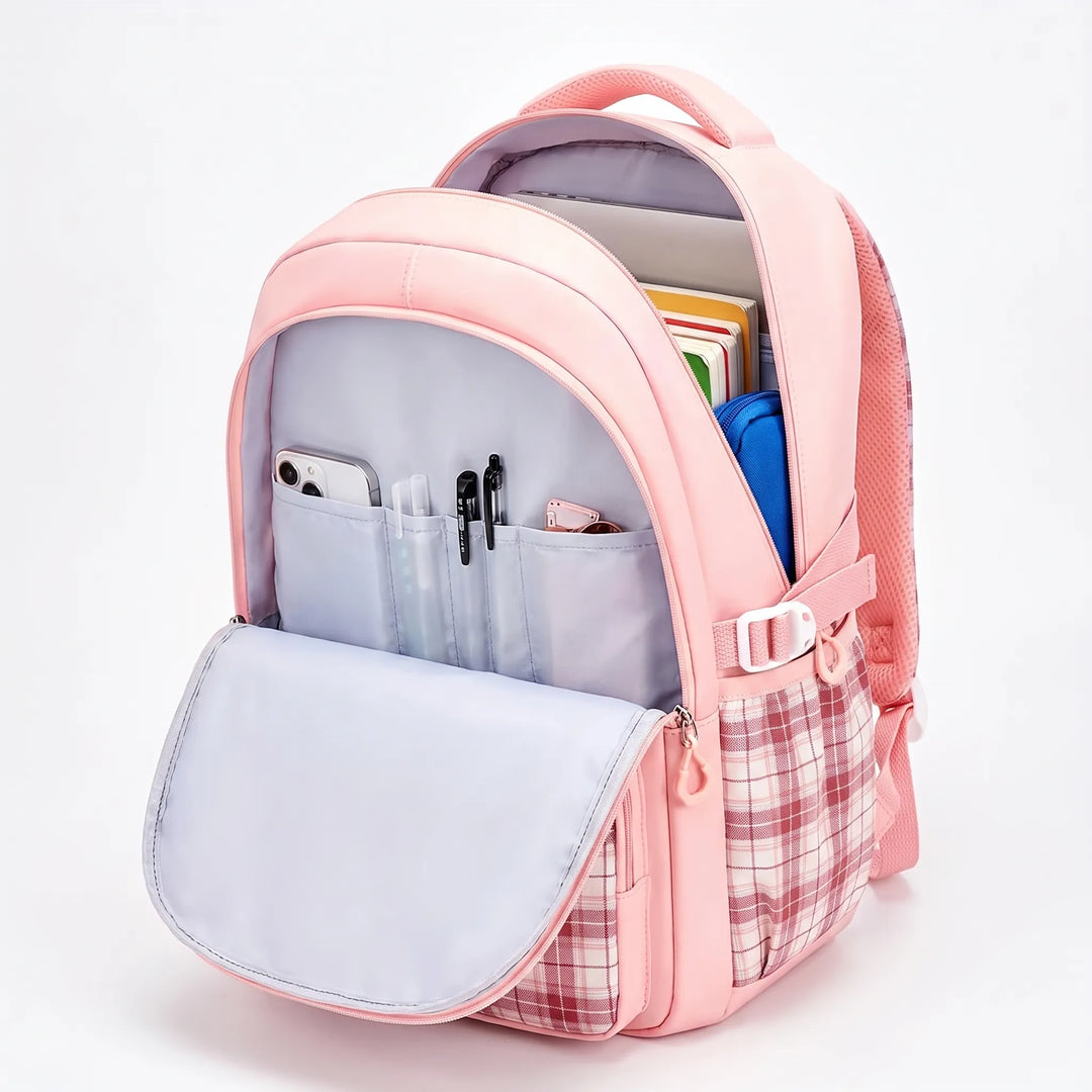 Pink backpack with the main compartment open, showing padded gray lining, pen slots, a phone pocket, notebooks and a blue pouch.