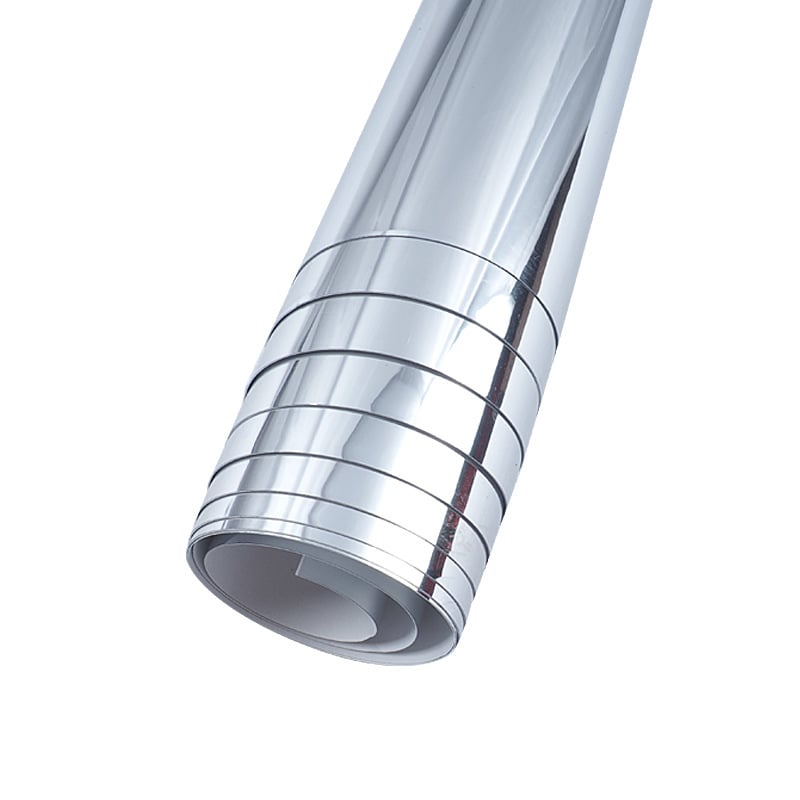 Close-up of the silver mirror film rolled up on a white background 2