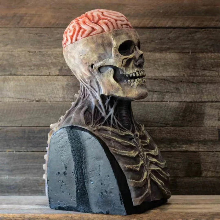 Skeleton mask and chest piece on a bust stand, detail.