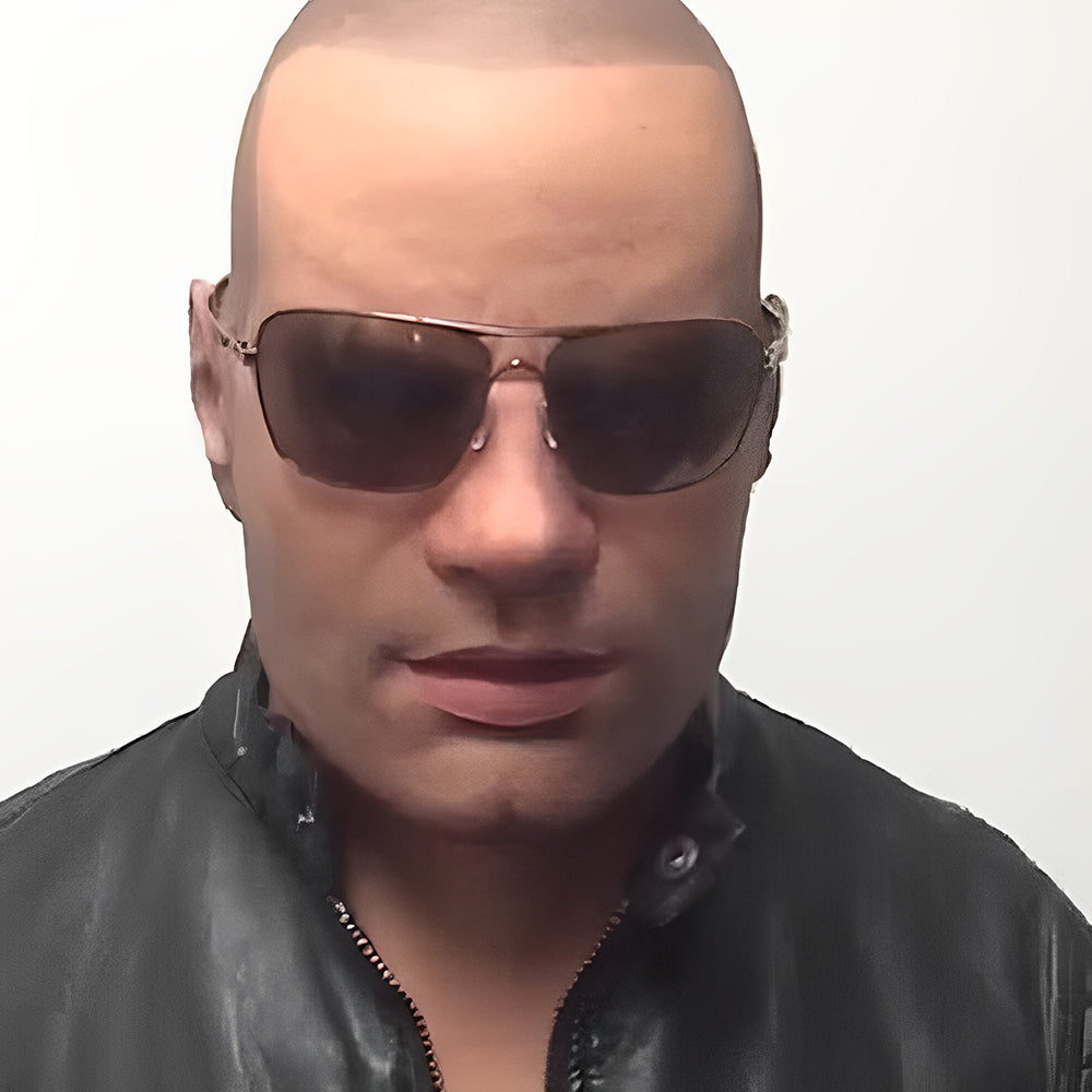 Bald male mask with a smooth head and dark aviator sunglasses, worn with a black zip-up leather jacket