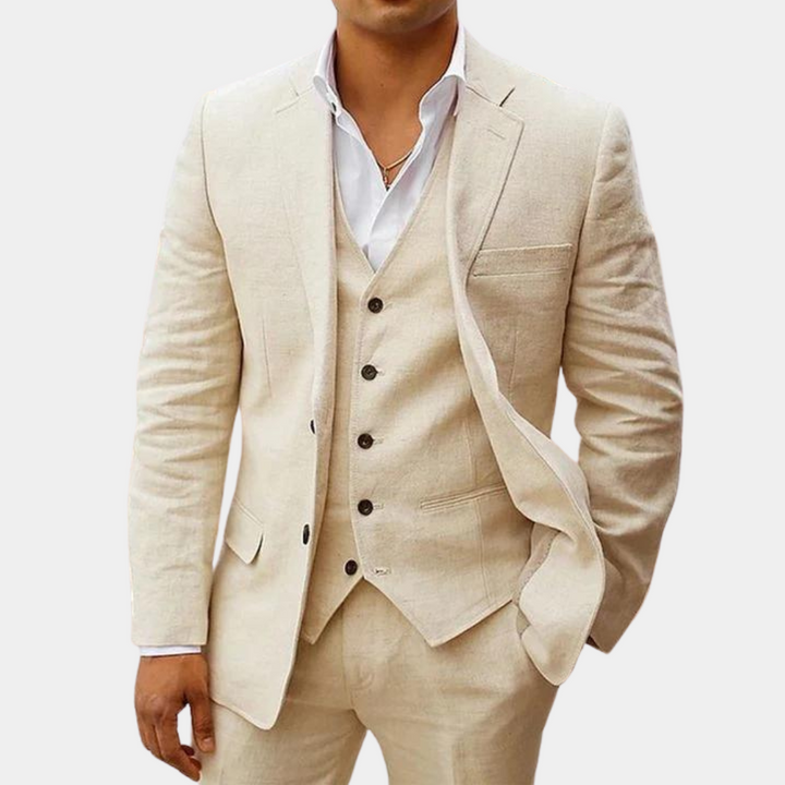 Men's three-piece suit in cream beige linen-look fabric, jacket open over a five-button vest and white shirt.