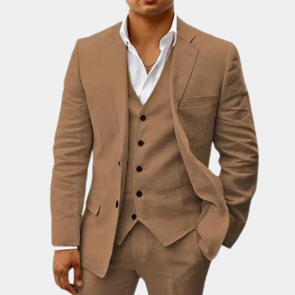 Men's three-piece suit in light brown, detail of the notch-lapel jacket open over a matching five-button vest and white open-collar shirt.