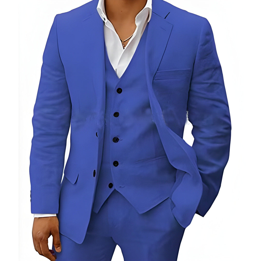 Men's three-piece suit in bright royal blue, detail of the jacket open over a matching vest with black buttons and a white shirt.