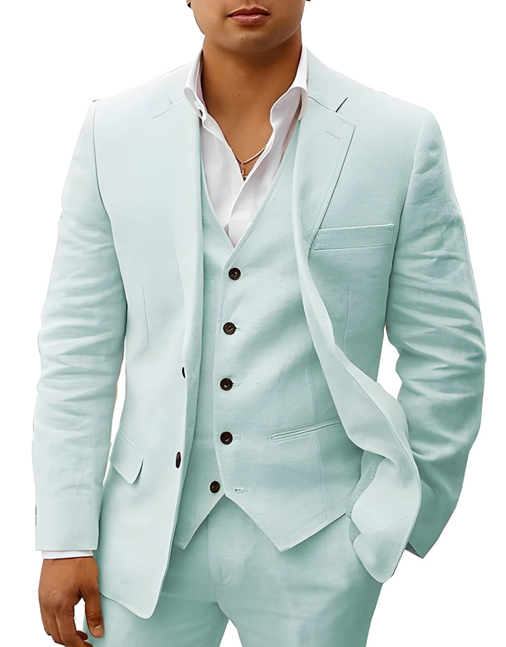 Men's three-piece suit in pale mint green, detail of the jacket open over a matching vest with dark buttons and a white shirt.
