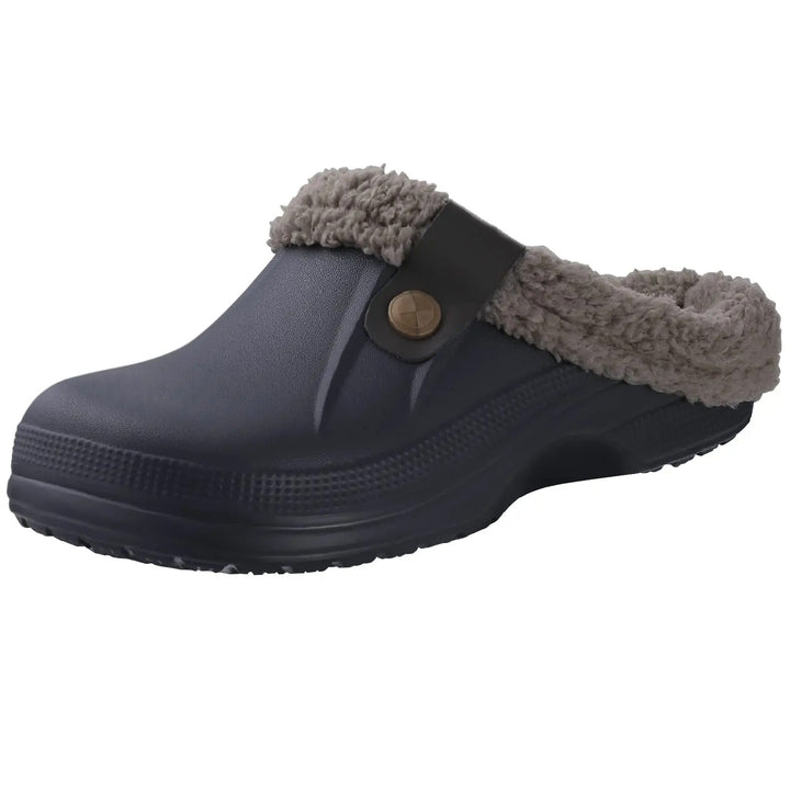 Dark navy clog with gray fleece collar and brown strap, shown at a three-quarter angle 3