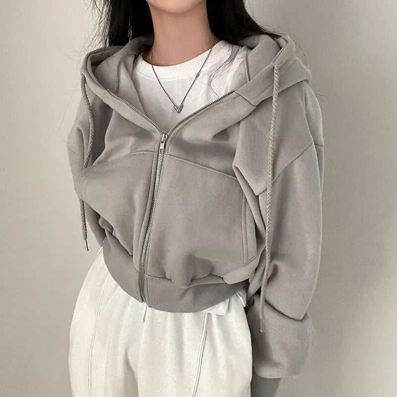 Ladies' short-cut vest with hood and oversized fit – Rinette