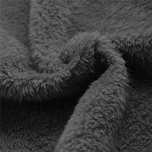 Close-up of the soft dark gray plush fleece lining, swirled to show its fluffy, dense pile texture. 5