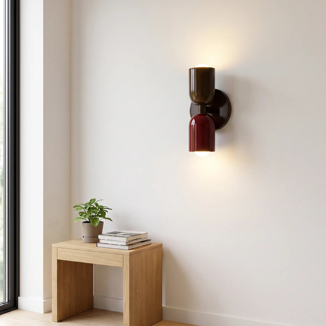 Retro wall lamp in glossy dark brown and burgundy on a white wall