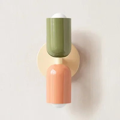 Retro wall lamp with an olive green top shade, coral lower shade and cream round backplate