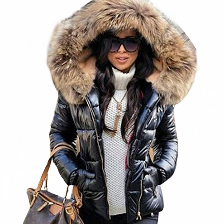 Black quilted parka with a big brown fur hood, shown on a model holding a brown handbag.