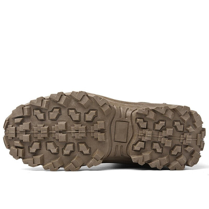 Underside of a brown boot showing the full lugged outsole tread pattern 18