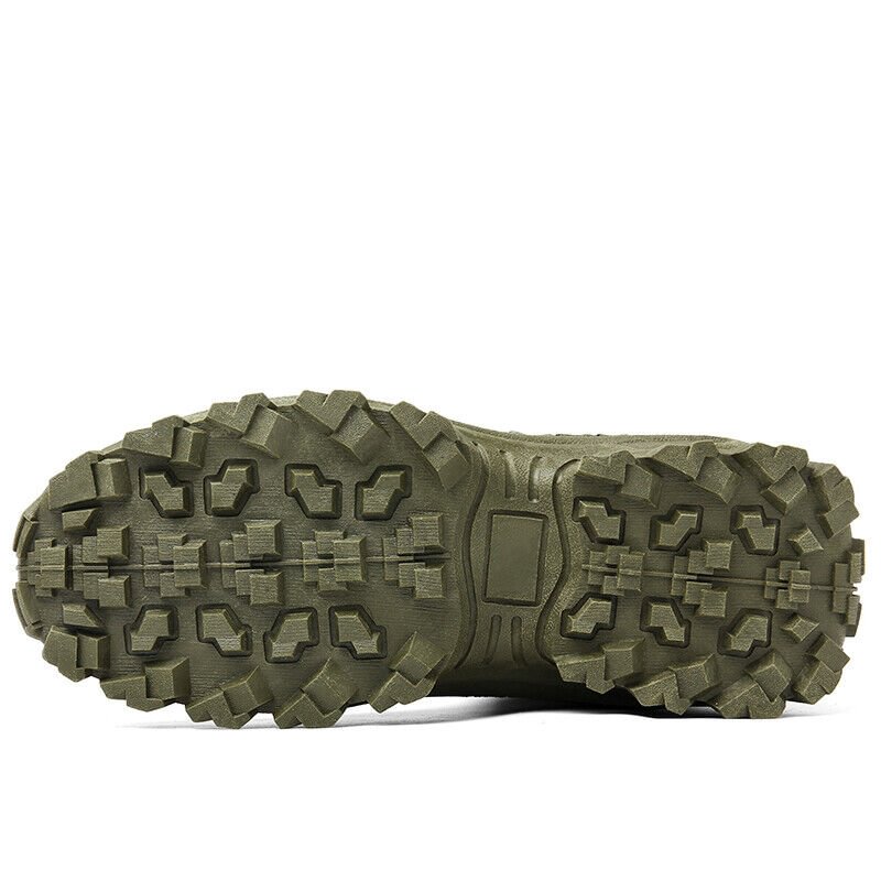 Close-up of the olive green boot's outsole with deep, chunky lugs and a flat center panel 22