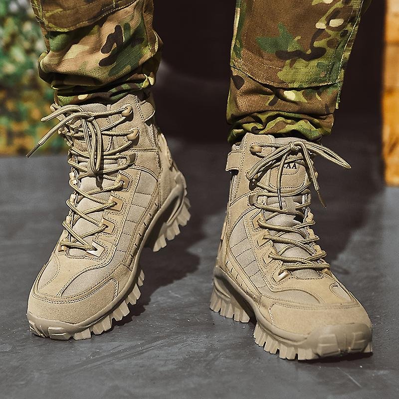 Front view of both tan laced boots with side zipper and tread, worn with camouflage pants 3