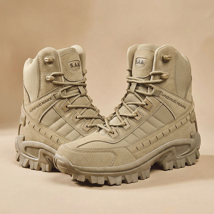 Pair of sand-colored high-top boots angled toward each other, showing laces, suede overlays and tread on a beige backdrop 24