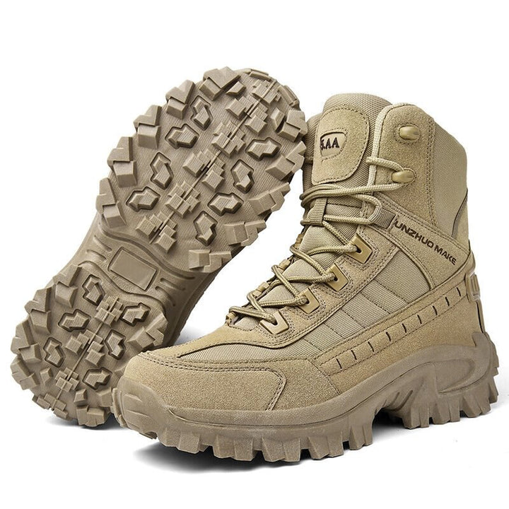 Tan boot beside its upturned mate on white, showing the lugged tread pattern and heel pad 9