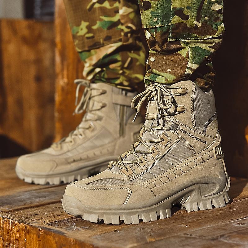 Sand-colored suede and fabric lace-up boots worn with camouflage pants on a wooden platform, side-zip visible 2