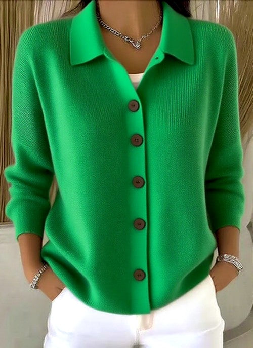 Women's cardigan in green with brown buttons and ribbed cuffs, another view.