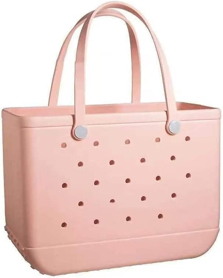 Light peach pink perforated tote with two tall handles and round buttons on a white background.