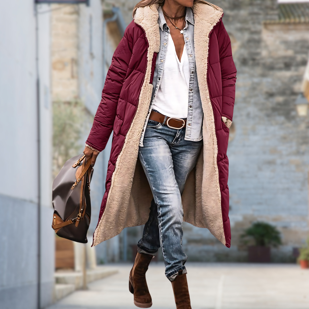 Burgundy quilted long coat with fleece lining worn open outdoors with jeans and suede boots 6