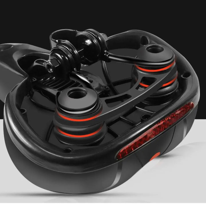 Underside of the saddle showing the metal rails, clamp and red reflector.