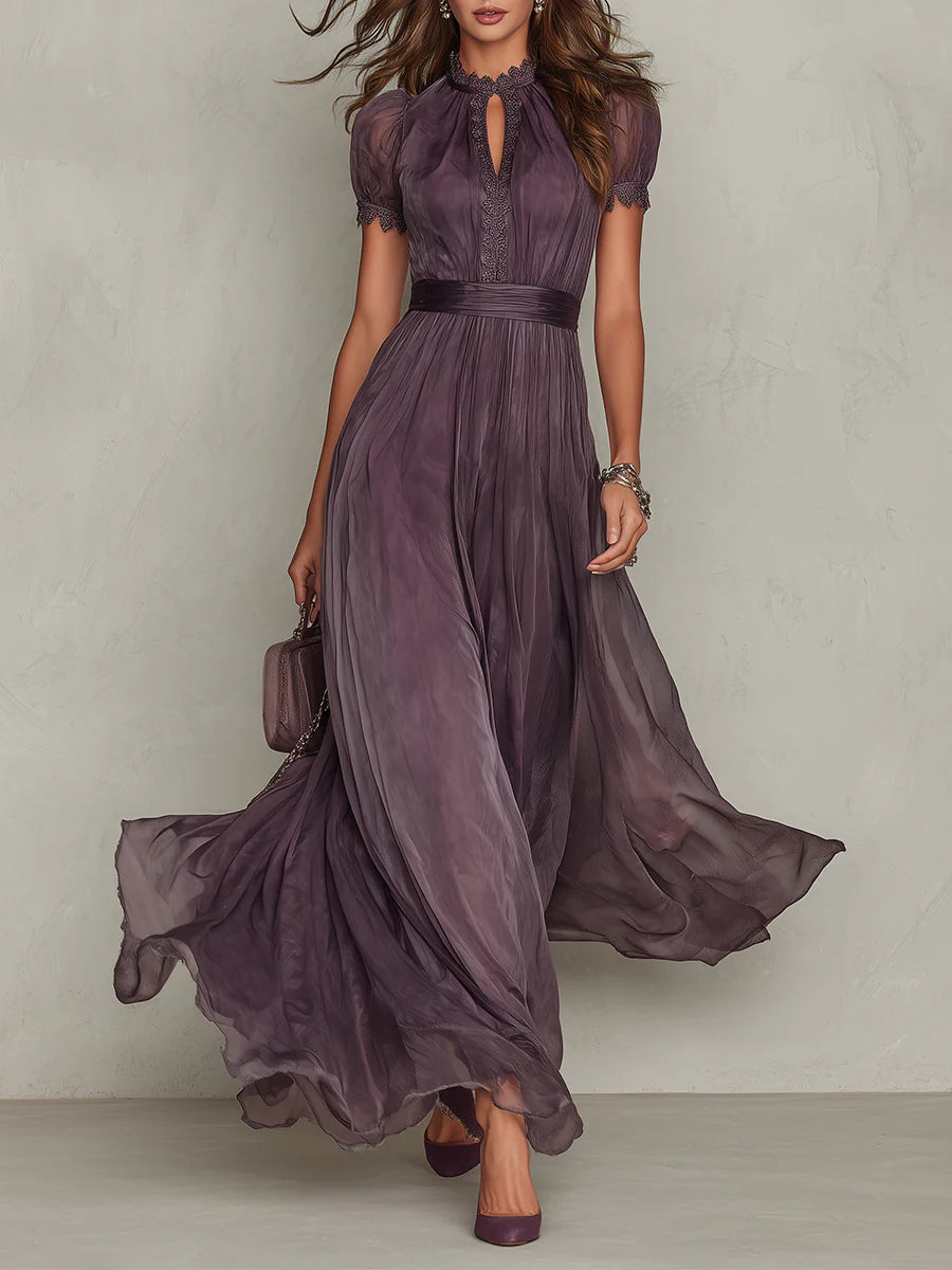 Women's purple maxi dress with a lace keyhole neckline and flowing skirt.